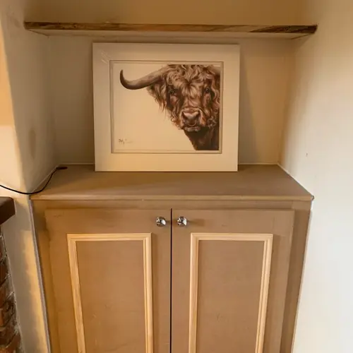 Bespoke alcove cupboard with a rustic oak shelf