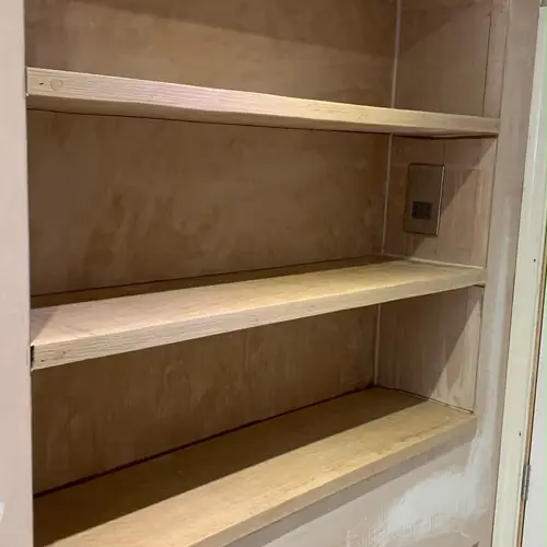 Bespoke oak alcove shelves fitted above a radiator