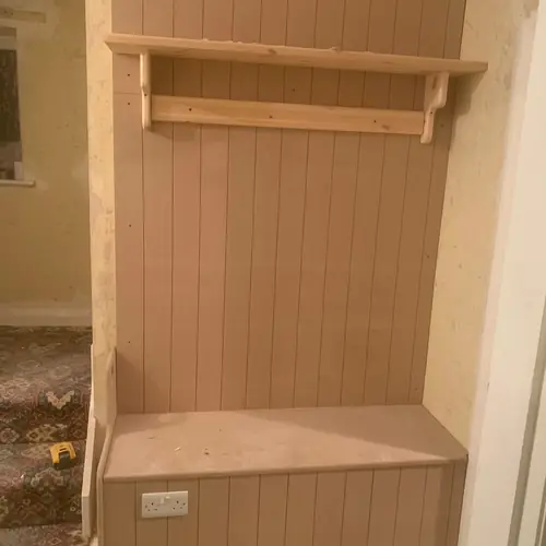 Boot room bench with tongue-and-groove panelling and a coat shelf