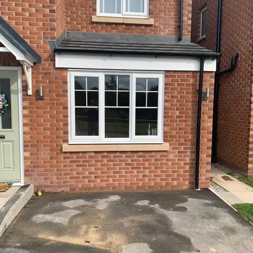 Brick front porch extension with a tiled roof