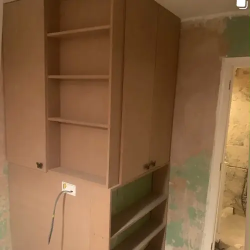 Built-in alcove cupboard and shelving under construction