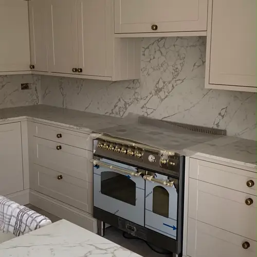 Cream shaker kitchen with a range cooker
