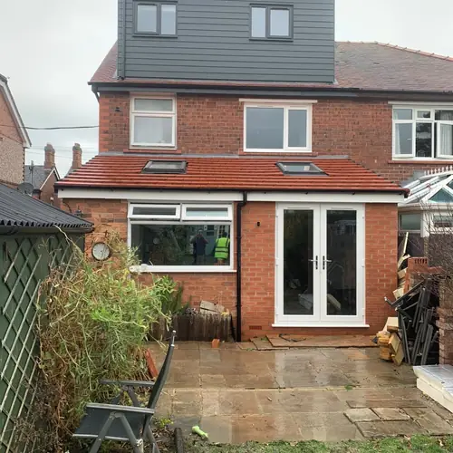 Completed dormer loft conversion and rear extension with French doors