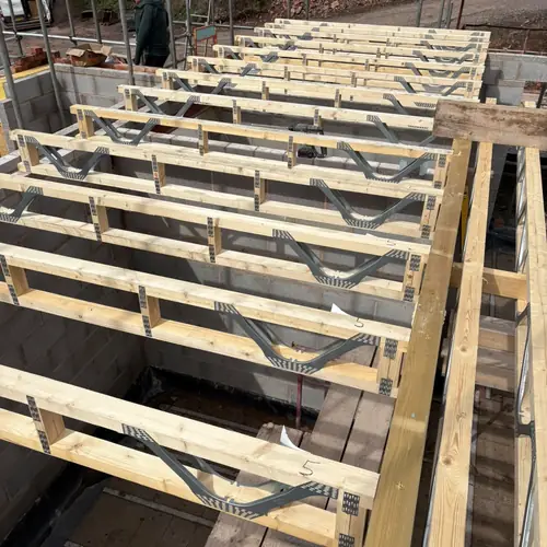 Floor joists being installed on a building site