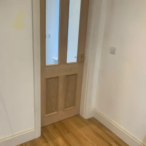 Glazed oak internal door with oak-effect flooring