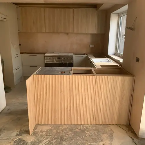 Kitchen units and island being installed