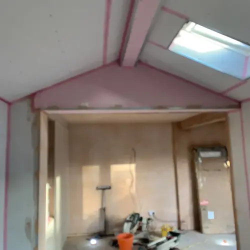 Loft conversion with new stud walls and a roof window