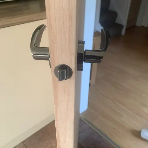 Close-up of a new handle fitted to an oak internal door