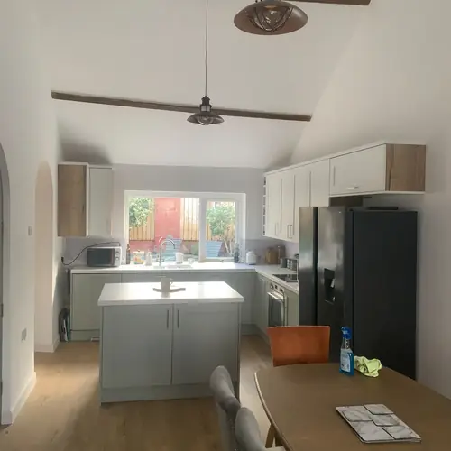 Open-plan kitchen diner with feature ceiling beams