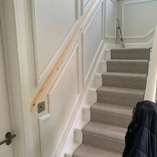 Panelled staircase with a new handrail