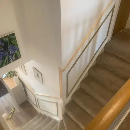 Staircase wall panelling and handrail