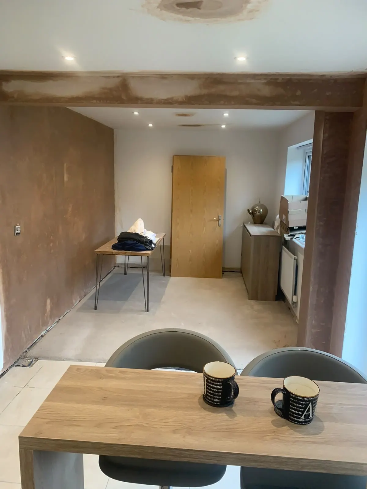 Kitchen diner renovation with an exposed beam and breakfast bar