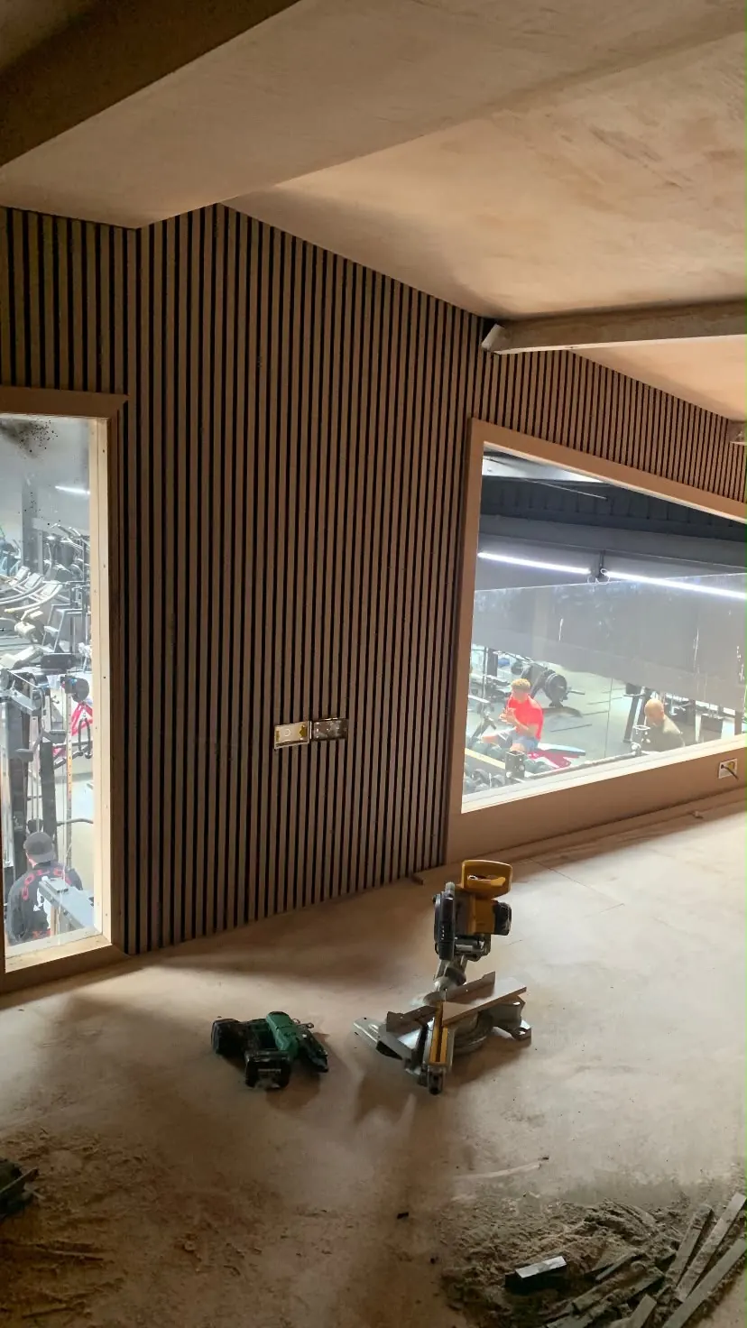 Slatted timber wall panelling fitted in a commercial showroom